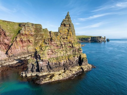 Aerial view of the rugged coastal landscape with the Duncansby Stacks, Duncansby Head coast, County
