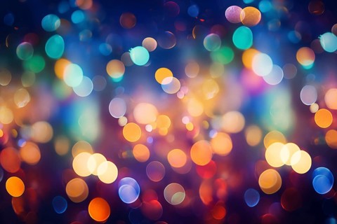 An abstract and colorful defocused blurred bokeh background with bright lights and festive