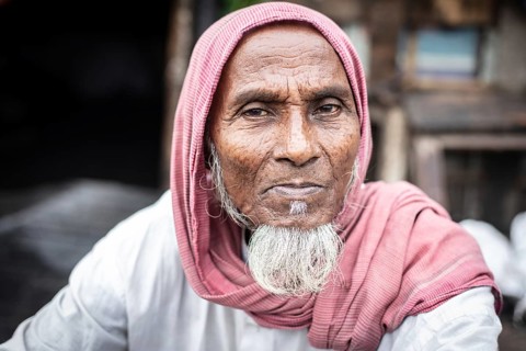 Man in front of his house, Tejgaon Slum Area, Dhaka, Bangladesh, Asia