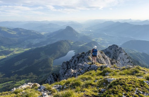 Hintersteiner Lake in the mountains, view from Schaffauer, hiker on a ridge in the mountains,