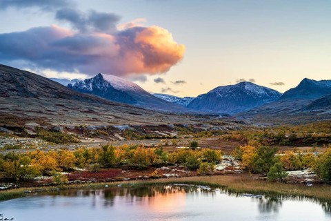 Mountains and lake in autumnal mountain landscape, Rondane National Park, Norway, Europe