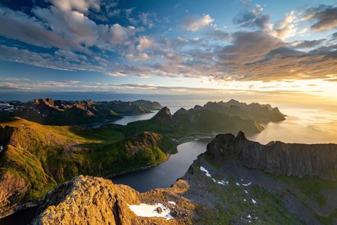 View over Senja's fjords and mountain peaks under the midnight sun, Mount Grytetippen, Senja,