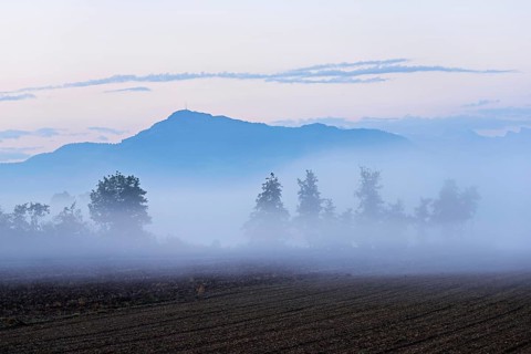 Early morning fog in the Reuss valley, behind the Rigi, Mühlau, Freiamt, Canton Aargau,
