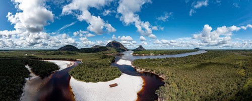Black river and white sand beach before the granite hills, Cerros de Mavecure, Eastern Colombia