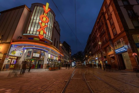 The Vox cinema in Strasbourg is illuminated at night. Bas-Rhin, Alsace, Grand Est, France, Europe