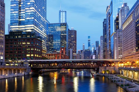 Skyline skyscrapers skyscrapers on the Chicago River bridge at night in Chicago, USA, North America
