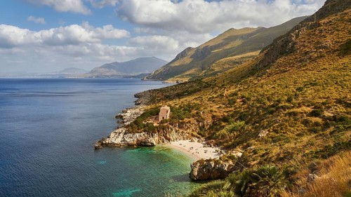 Cloudy weather, coastline, green coastal mountains, small bay, pebble beach, bathers, Zingaro,