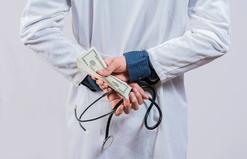 Medical corruption and bribery concept. Corrupt doctor hiding money back, Dishonest doctor hiding