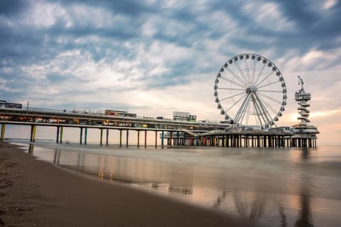 Ferris wheel at sunset on the pier at the beach, The Hague, Netherlands