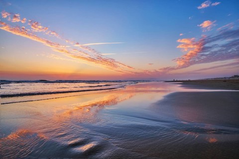 Atlantic ocean after sunset with surging waves at Fonte da Telha beach, Costa da Caparica,