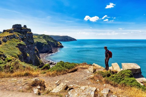 South West Coast Path, walkers on coastal path, Valley of the Rocks, rocky coast in Exmoor National