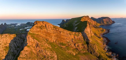 Coast and mountains in the evening light, Vaeroy Island, Vaeroy, Lofoten, Norway, Europe