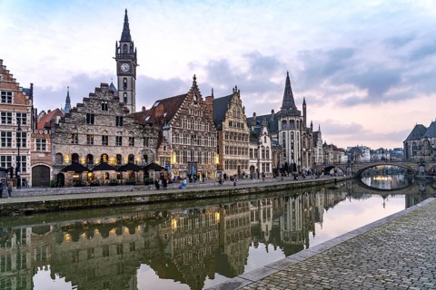 Medieval guild houses of Graslei Kai on the river Leie at dusk, Ghent, Belgium, Europe