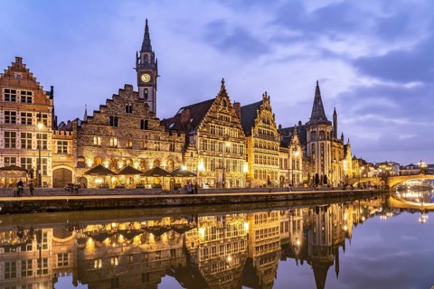 Medieval guild houses of Graslei Kai on the river Leie at dusk, Ghent, Belgium, Europe