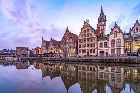 Medieval guild houses of Graslei Kai on the river Leie at dusk, Ghent, Belgium, Europe