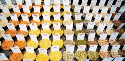 Samples of pulses kept on display inside a shop at a wholesale market ahead of the presentation of