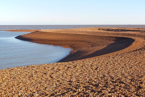 View out to North Sea from shingle beach at Shingle Street, Suffolk, England, UK