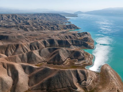 Barren landscape, aerial view, erosion landscape with canyons on the Naryn River, Toktogul
