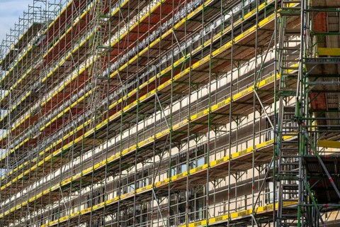 Large construction site, scaffolded shell of an office and commercial building complex, Bochum