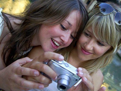 Two woman taking a selfie with the camera, Barcelona, Spain, Europe