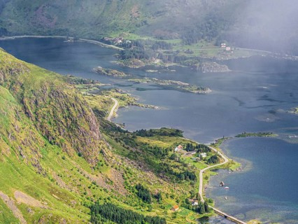 View from top of mountain Justadtinden towards east over Rolvsfjorden, road no. 815, island