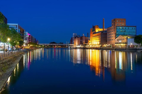 The inner harbour, Duisburg, former mills and warehouse buildings, modern office buildings, left,
