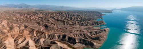 Barren landscape, aerial view, erosion landscape with canyons on the Naryn River, Toktogul