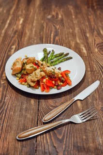 Spicy chicken stew with vegetables and fried asparagus