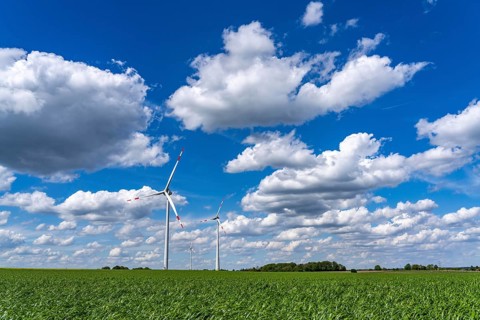 Wind farm, wind turbine, wind turbines from the manufacturer Enercon, blue sky with many white