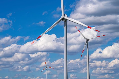 Wind turbine, wind energy plant from the manufacturer Enercon, blue sky with many white clouds,