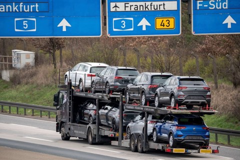 A5 motorway, car transporter with various new VW cars, passenger car