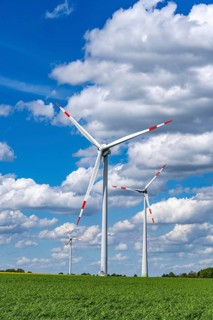 Wind farm, wind turbine, wind turbines from the manufacturer Enercon, blue sky with many white