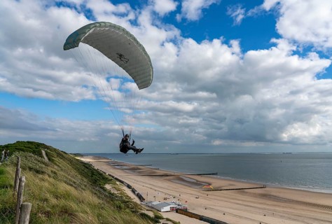 Paragliders along the dunes of Zoutelande, in Zeeland, South Holland, Netherlands