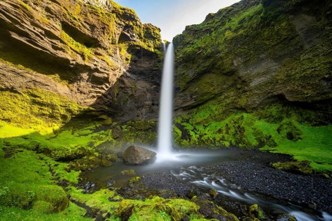 Kvernufoss waterfall, in summer when the weather is fine, gorge and river, long exposure, Skogar,