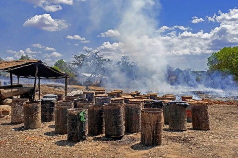 Old discarded oil barrels for the production of Toaka gasy, Malagasy rum near Tulear, Toliara,