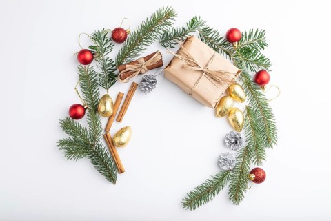 Christmas or New Year wreath composition. Decorations, balls, fir and spruce branches, on white