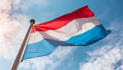 Flags, the national flag of Luxembourg flutters in the wind