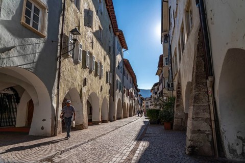 The town of Neumarkt, in the Adige Valley, in South Tyrol, arcades in the old town centre, in front
