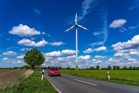 Wind turbine, wind energy plant from the manufacturer Enercon, blue sky with many white clouds,