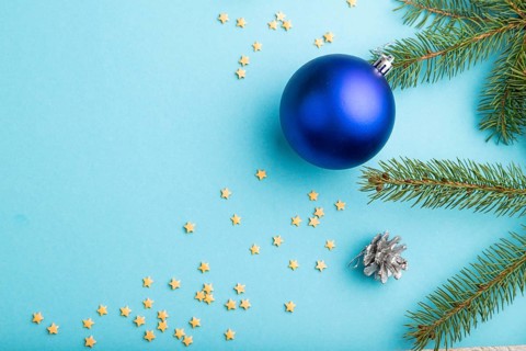 Christmas or New Year composition. Decorations, blue balls, cones, fir and spruce branches, on a
