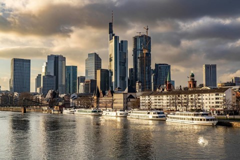 Skyline of the city centre of Frankfurt am Main, river Main, excursion boats at the Mainkai, dusk,