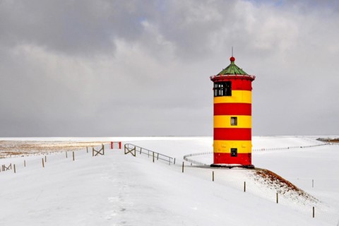 The lighthouse of Pilsum in winter, East Frisia, Lower Saxony, Federal Republic of Germany