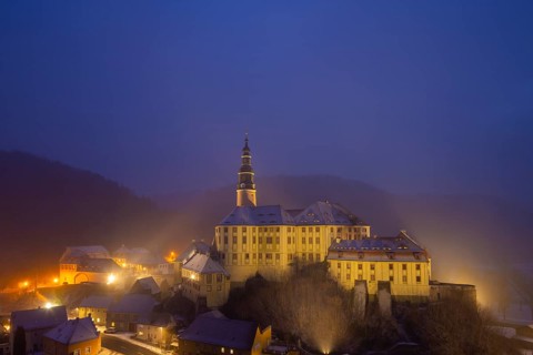Winter evening in the Müglitz valley, impressively illuminated Weesenstein Castle at the blue hour,