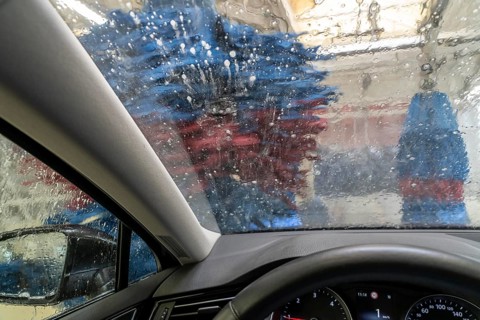 Car in an automatic car wash, car wash tunnel