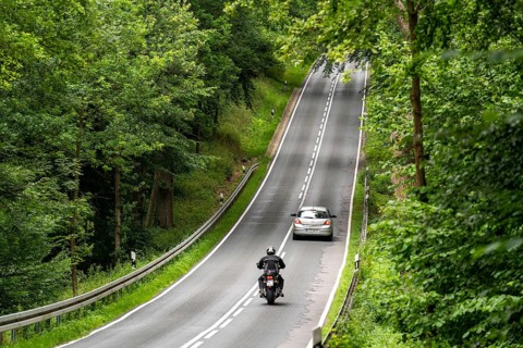 Country road through a forest, near Hofgeismar, in Hesse, Germany, Europe