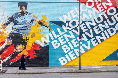 Large-format mural welcoming football fans to EURO 2024 at Dortmund Central Station, North