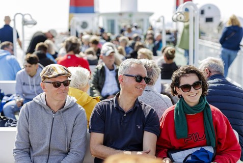 Tourists on the ferry Münsterland operated by shipping company AG Ems, crossing from the mainland