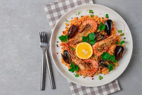 Seafood paella, shrimp and mussels risotto, rice, homemade, top view, no people