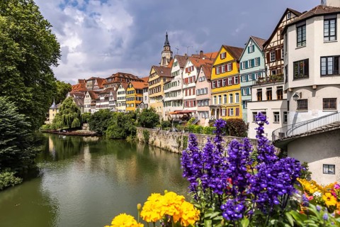 Tübingen Neckarfront with Neckar and historic facades. Postcard motif with collegiate church and