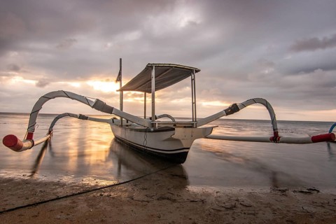 Jukung in the sea, typical landscape shot with a view of the horizon over the water, taken from a